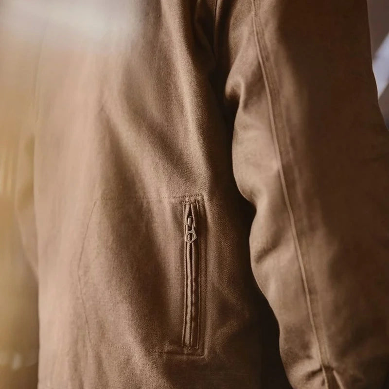 Angled hand pocket on brown Detroit jacket